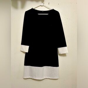 Black and white dress. Size reads large, but probably would be a 4/6.